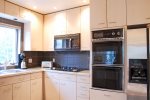 Kitchen with gas cooktop and gas oven and broiler